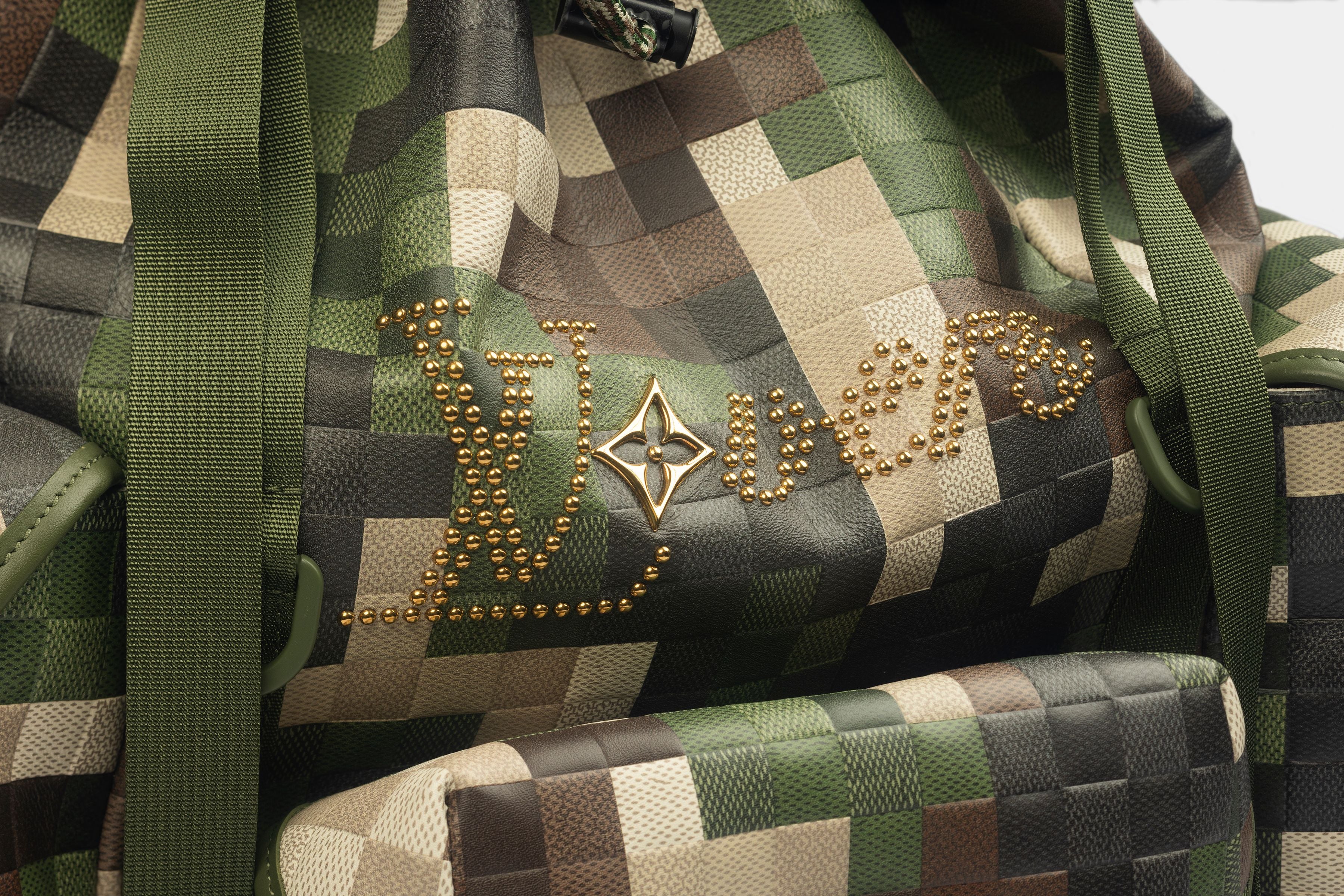 Detailed image of the Louis Vuitton Trail Backpack and writing on it