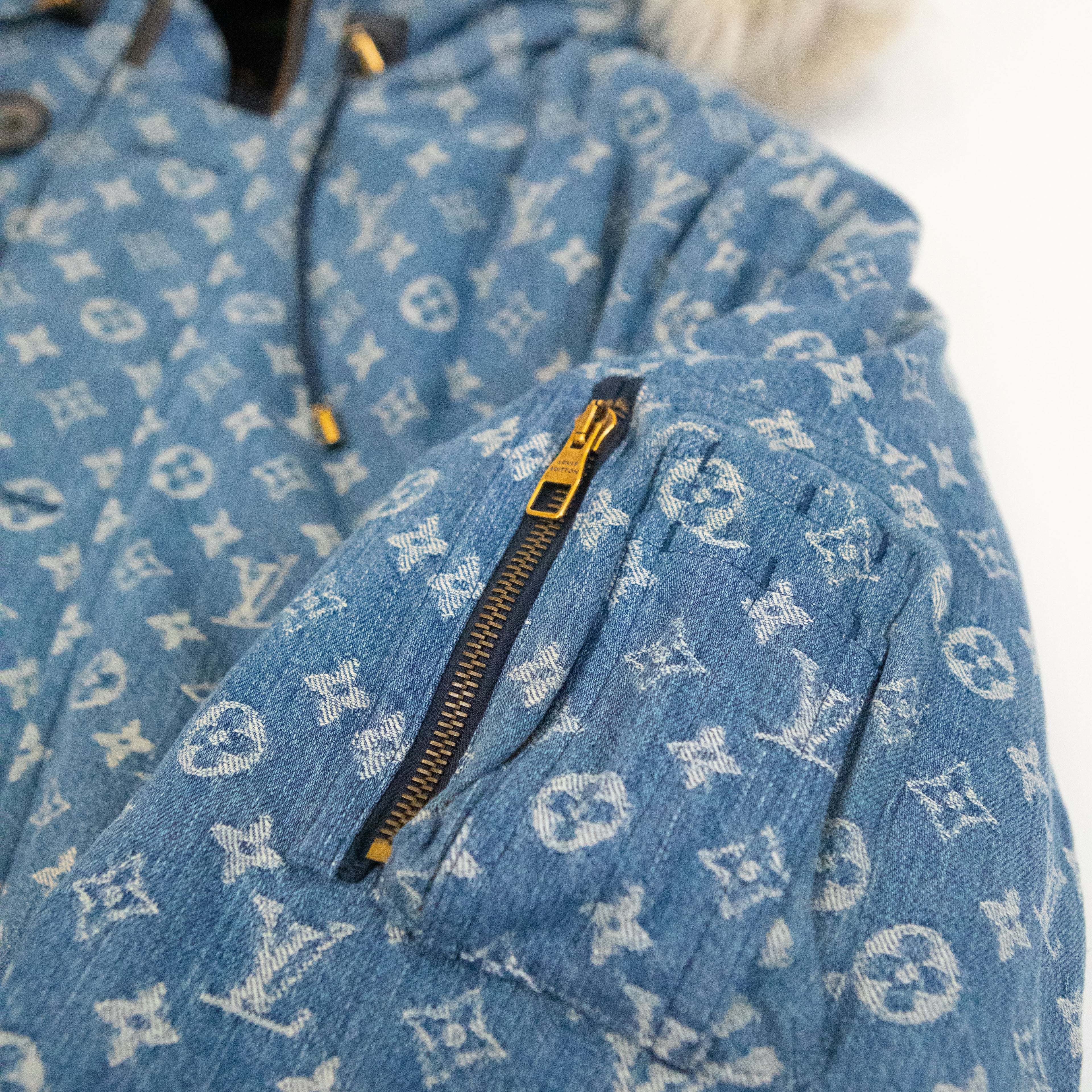 Close up of the Supreme Louis Vuitton Jacquard Denim N-3B Parka showing one of the zipper pockets