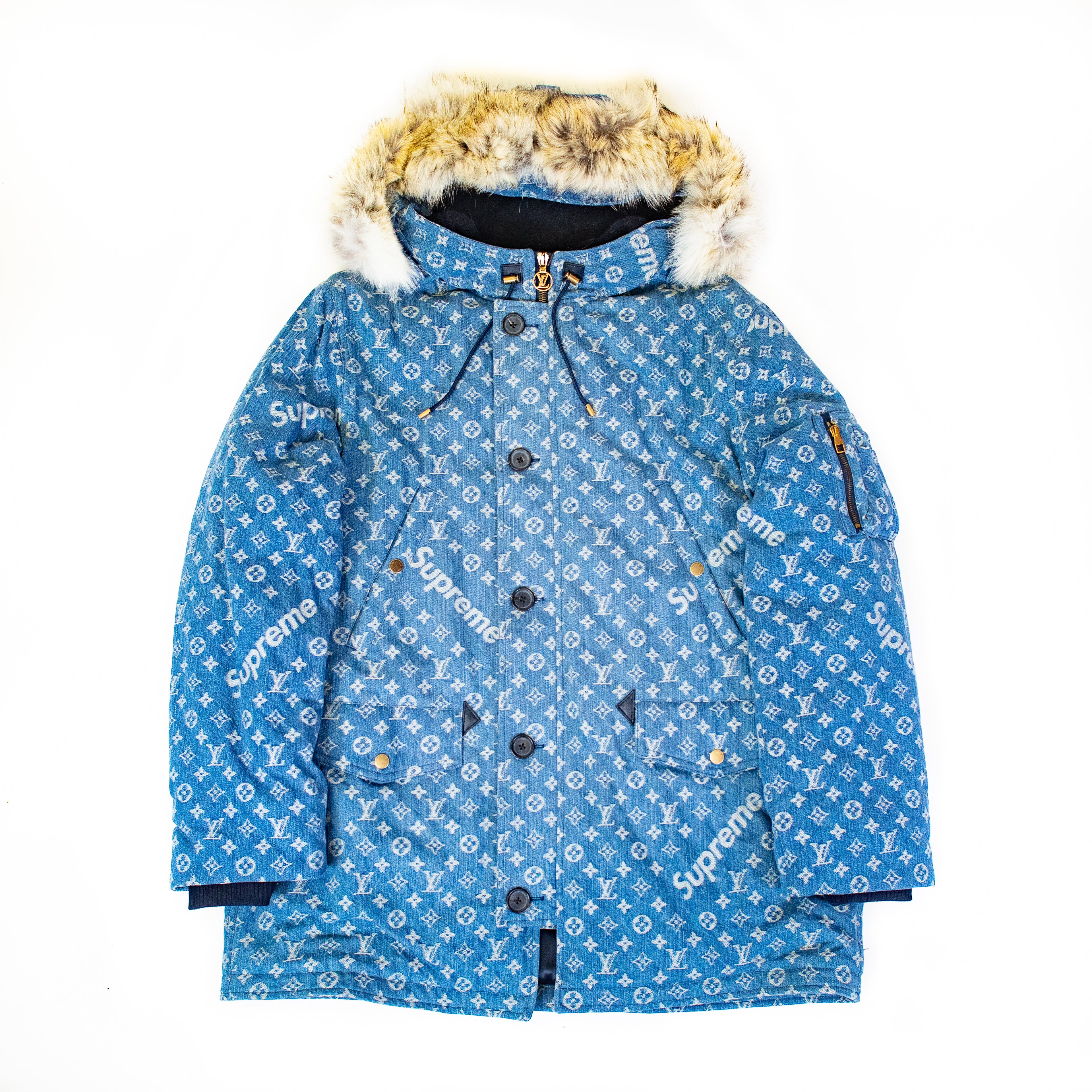 The Supreme Louis Vuitton Jacquard Denim N-3B Parka. Showing the Supreme and LV detailing along with the fur hood