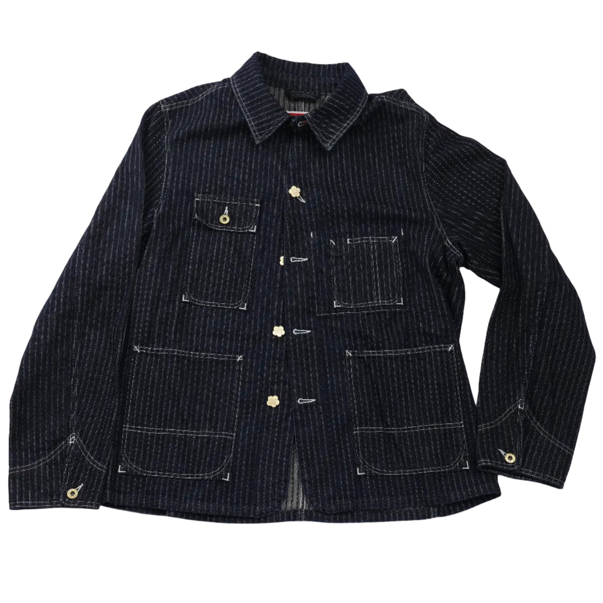 A dark navy blue pinstriped jacket with white contrast stitching and brass buttons, laid flat on a white background.