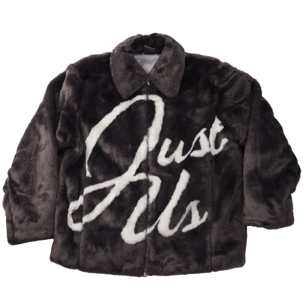 A dark brown faux fur jacket with a large white cursive 'Just Us' text graphic on the front, laid flat against a white background.