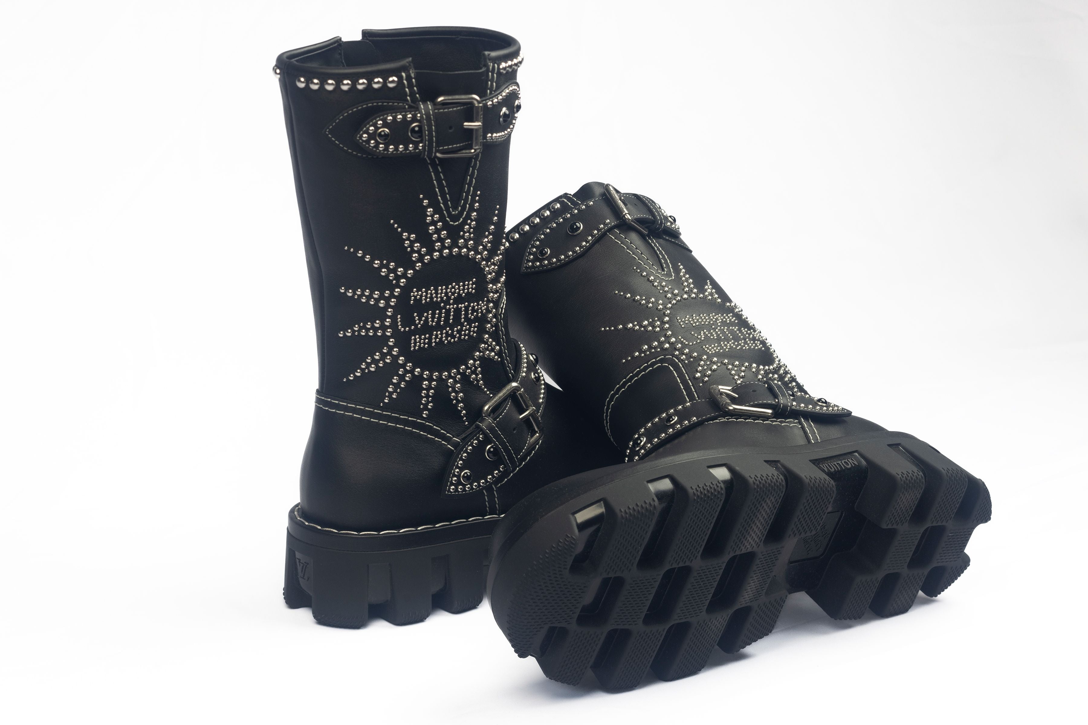 Black/silver Louis Vuitton Checkered Mid Boot shows black outsole