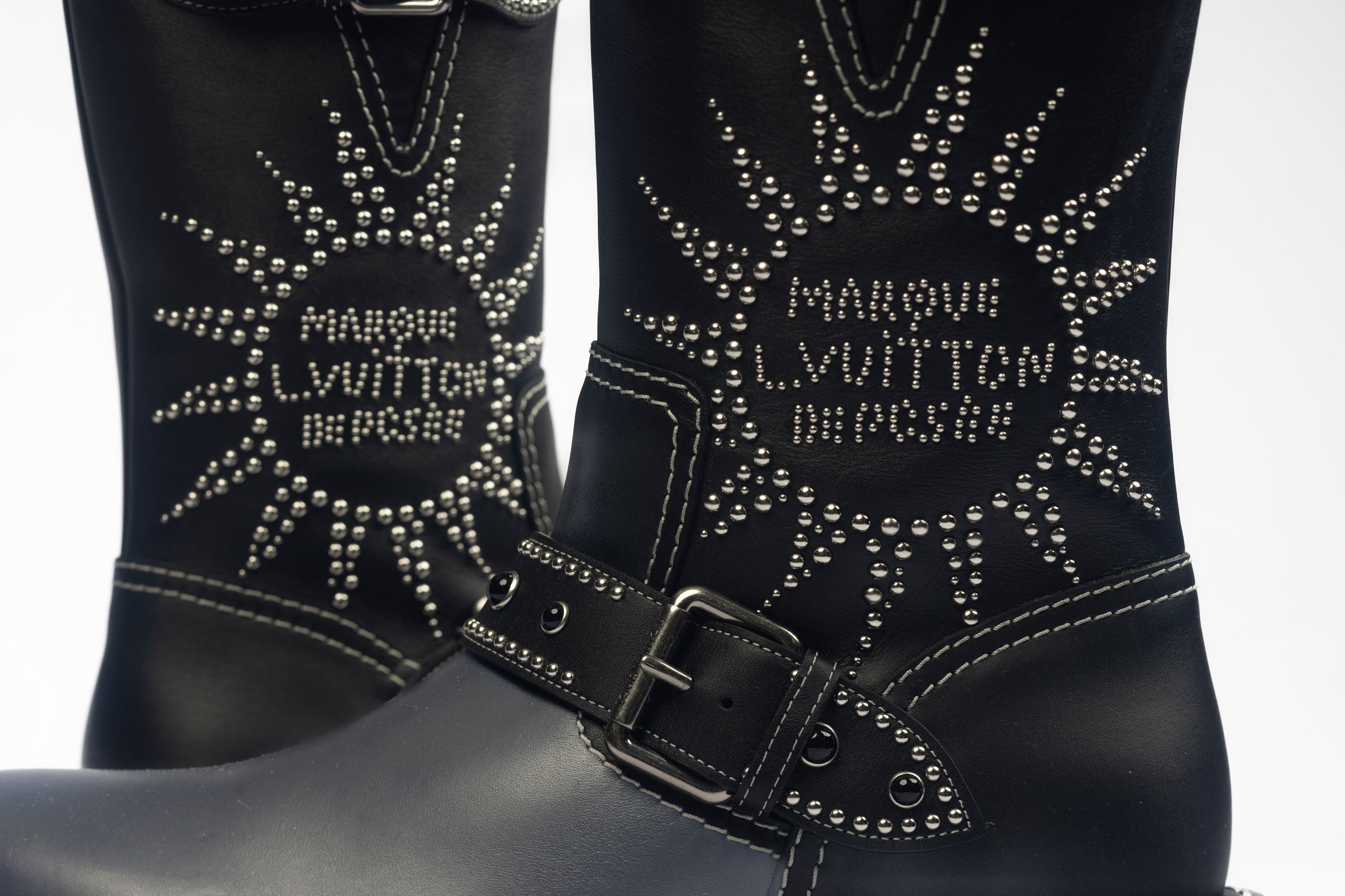 Close up of the details of sequences on the boot showing the Marque LVuitton Despoee writing